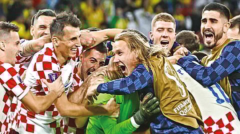 Croatia players celebrate their win over Brazil