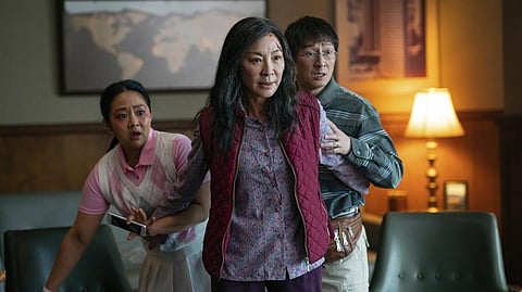 This image released by A24 Films shows, from left, Stephanie Hsu, Michelle Yeoh and Ke Huy Quan in a scene from, "Everything Everywhere All At Once."