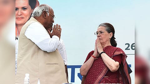 Congress President Mallikarjun Kharge greets former Congress President Sonia Gandhi.