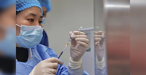 A nurse prepares a shot of Covid vaccine at a community health center in Nantong in eastern China's Jiangsu province