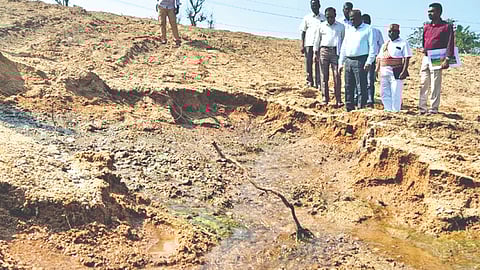 Collector D Baskara Pandian and PWD officials inspecting the renovated spring channel near Ocheri on the Ranipet - Kancheepuram border