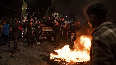 Palestinians celebrate after a shooting attack