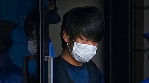 Tetsuya Yamagami, the alleged assassin of Japan's former Prime Minister Shinzo Abe, exits a police station in Nara, western Japan, on July 10, 2022, on his way to local prosecutors' office.