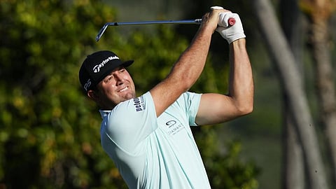 Taylor Montgomery plays his shot from the 11th tee during the second round of the Sony Open golf tournament at Waialae Country Club in Honolulu.