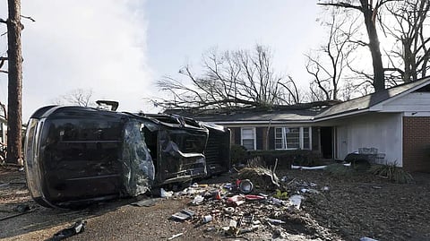 A vehicle is upended, and debris is strewn about follow a tornado near Meadowview elementary school.