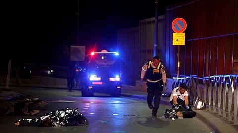 dead covered bodies at the scene of a shooting attack in Neve Yaacov