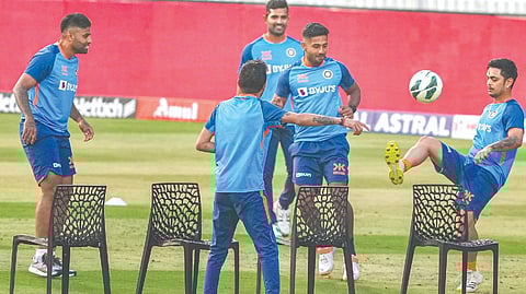 India players enjoy a game of foot tennis during a training session.