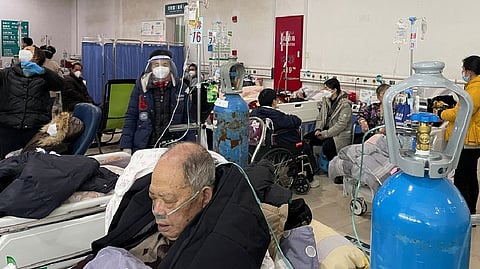 Patients lie on beds in the emergency department of a hospital, amid the coronavirus disease (COVID-19) outbreak in Shanghai