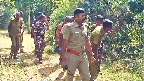 A team of the Forest department officials involved in
tracking wild jumbo Karuppan at Sathyamangalam
Reserve Forest on Tuesday