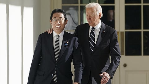 Joe Biden and Fumio Kishida walk along the Colonnade of the White House, on January 13, 2023, in Washington.