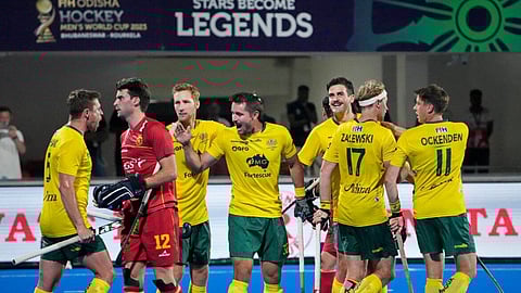 Australian Jeremy Hayward (centre) celebrates with teammates after scoring the team's forth goal during the 2023 Men's FIH Hockey World Cup quarter final match.