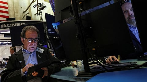 Traders work on the floor of the New York Stock Exchange (NYSE) in New York City
