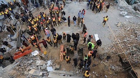 Rescue workers look for survivors in a mosque at Peshawar