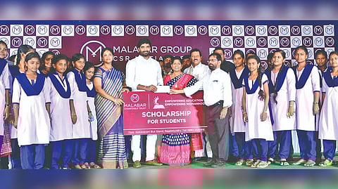 In the backdrop of the image, one can see a banner of the Trust which is part of the Malabar Group.