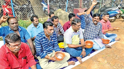 DPC staff protesting against TNCSC in Thanjavur on Monday