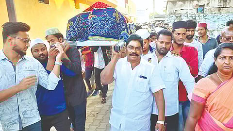 DMK MLA K Devaraji seen carrying the bier of youth killed in bull run in Jolarpet on Thursday