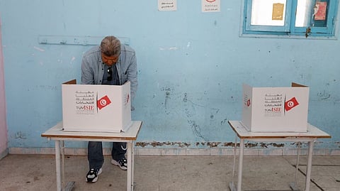 A voter casting his vote in the Tunisia elections