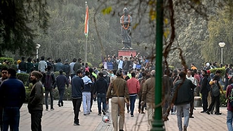 Students protest outside Faculty of the Arts, Delhi University, in New Delhi on Friday