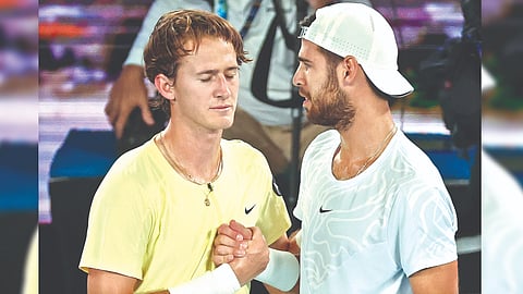 Karen Khachanov (right) consoles Sebastian Korda after the latter retired midway through the third set.