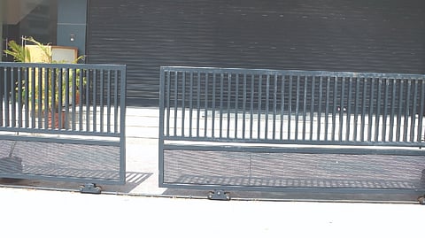 The gate at the entrance of the commercial building in Kilpauk that came off the rails and fell on Harini Shree