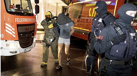 A man is taken into custody by a Special Operations Command