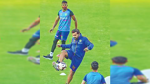 Rohit Sharma plays football during a practice session