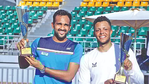 Arjun Kadhe (left) and Jay Clarke pose with the Chennai Open Challenger doubles trophies