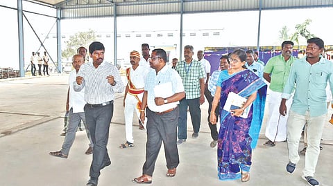 Tiruchy Collector M Pradeep Kumar (left) inspecting
the paddy godown at Srirangam Block, Adavathur