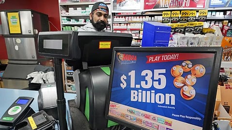 A Mega Million sign displays the estimated jackpot of $1.35 Billion at the Cranberry Super Mini Mart in Cranberry, Pa.