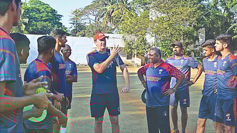 Glenn McGrath (centre) interacts with trainees of the MRF Pace Foundation on Monday