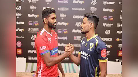 Calicut Heroes Ashwin Raj with Kochi Blue Spikers' Erin Varghese