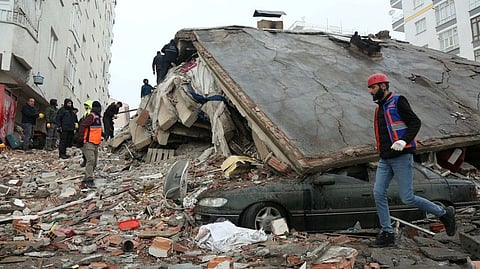 Rescuers search for survivors under the rubble following an earthquake in Diyarbakir, Turkey.