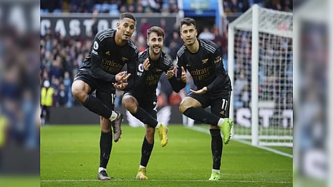 Martinelli celebrating his goal with his teammates at the Villa Park.
