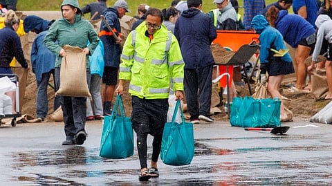 People carrying sand bags