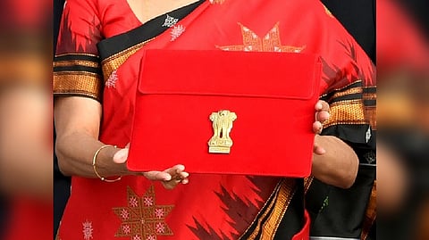 Nirmala Sitharaman shows her tablet ahead of the Budget