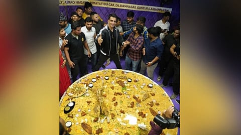 Sonu Sood posing with the biggest thali of the restaurant