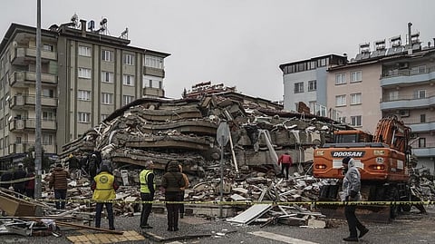 Emergency teams search for people in the rubble of a destroyed building in Gaziantep, Turkey.