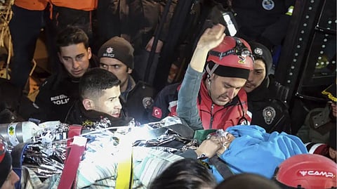 Rescuers surround Hatice after she was rescued 92 hours after Monay's earthquake