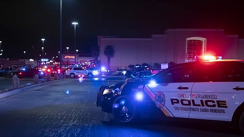 Police cars block the vehicles access to a shopping mall, Wednesday in El Paso, Texas.