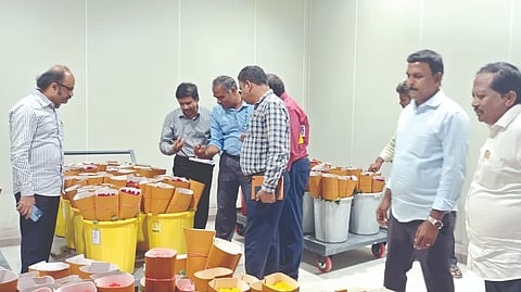 State Agricultural Marketing Board officials inspecting flower arrivals at the International Flower Auction Centre at Hosur