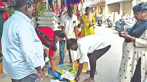 Officials seize plastic bags from shops in Bazar Street in Chengalpattu on Tuesday