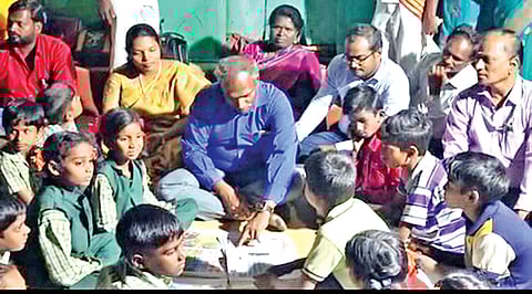 Tirupattur Collector D Baskara Pandian interacting
with children, residents at Mandarakuttai hamlet