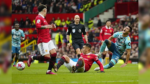 Manchester United's Casemiro, bottom centre, in action against Southampton's Carlos Alcaraz, right, during the English Premier League soccer match between Manchester United and Southampton at Old Trafford stadium in Manchester, England, Sunday