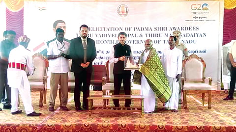 Governor Ravi felcitates a snake catcher on Thursday