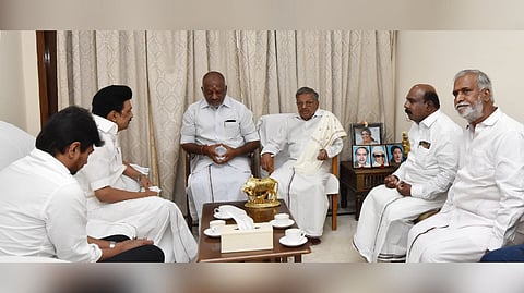 Stalin talking with O Panneerselvam
