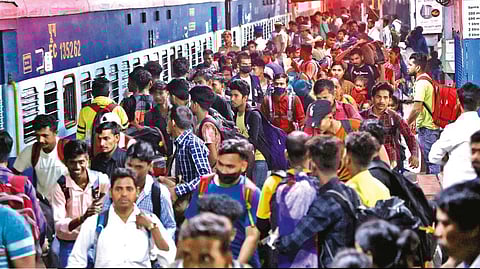 Migrant labourers boarding the train to reach their respective native places