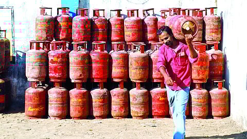 Worker transporting a LPG cylinder in Chennai