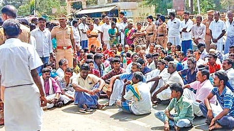 Irate relatives of the murdered woman block the Namakkal-Mohanur Road on Sunday