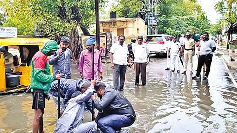 Water being drained out from Kasu Kadai Bazaar in Thoothukudi following rainfall on Wednesday