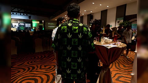 A man wearing a shirt with a marijuana leaf pattern attends the 1st Phuket Cannabis Cup in Phuket, Thailand